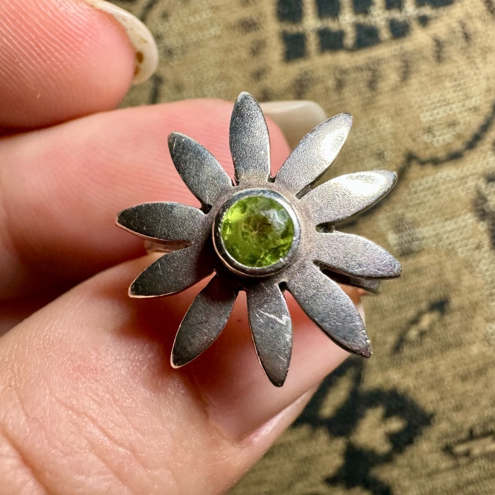 Peridot and sterling silver flower ring.